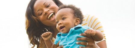 Mom laughs with her baby