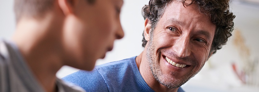Ohio 529 Covers Higher Education For Adults Too Father smiling at his talking son