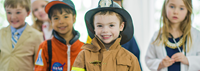 Boys and girls dressed up as a doctor, astronaut ,fire fighter, and business entrepreneur