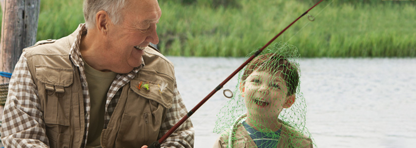 Grandfather and grandson fishing