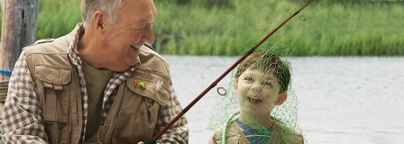 Grandfather and grandson fishing