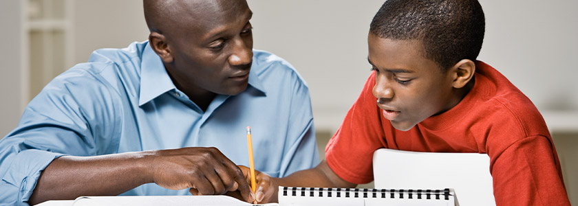 Father helping son with his homework