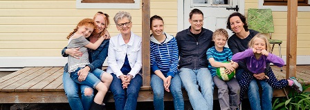 Extended family poses on porch