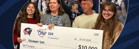 2026 CBJ College Saving Assist winner and family holding oversized check