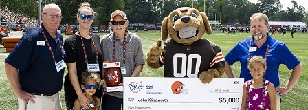 2026 Browns VIP Training Camp winner with Chomps, family, and oversized check