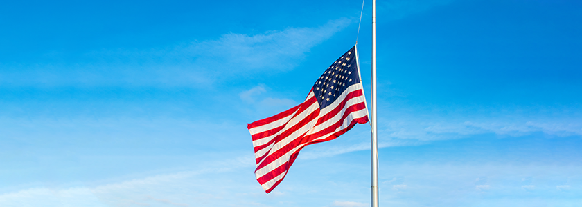 An America Flag flying at half-staff