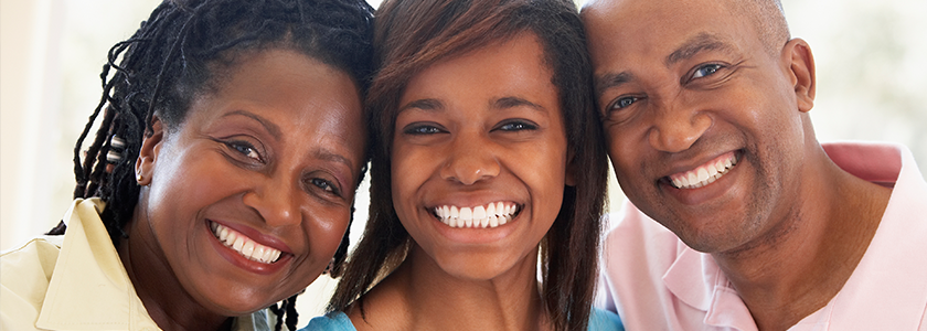 Ohio 529 Announces 2022-23 WAT Rate Parents smile proudly at camera with daughter in between