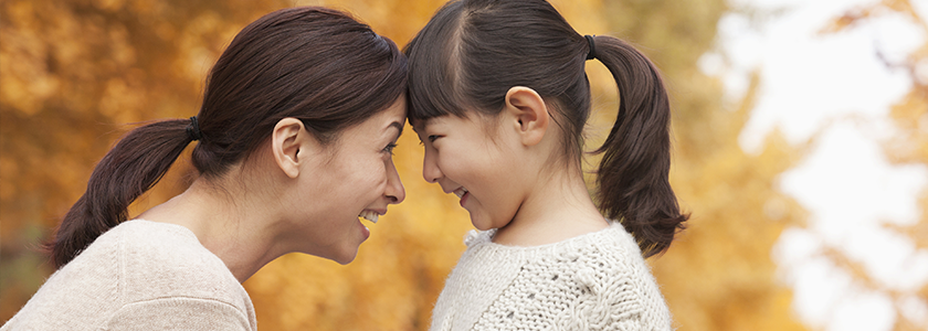 Rollover Your Higher Education Savings To Ohio 529 Mother touching her forehead to her daughter's. Both are smiling at each other.