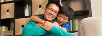 Father and son hug each other