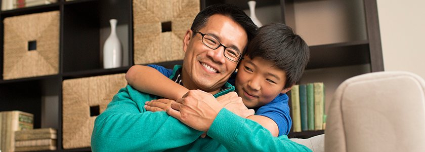 September Is College Savings Month Father and son hug each other