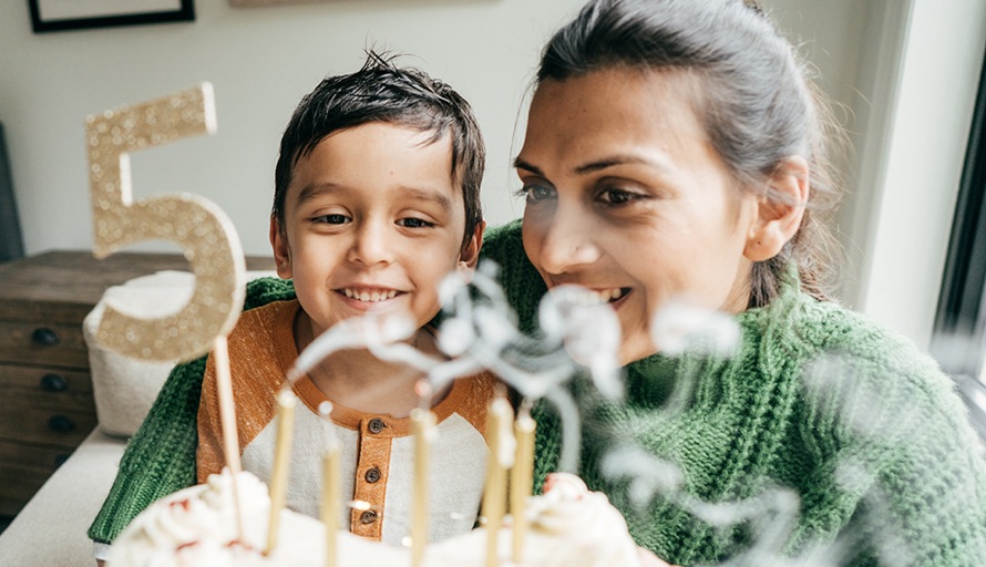 Mother and child celebrating a birthday