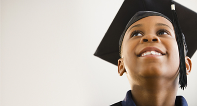 Image of child wearing graduation cap